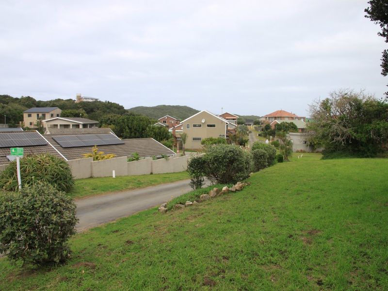 A view of the surrounding residential neighbourhood and street from the vacant land plot.