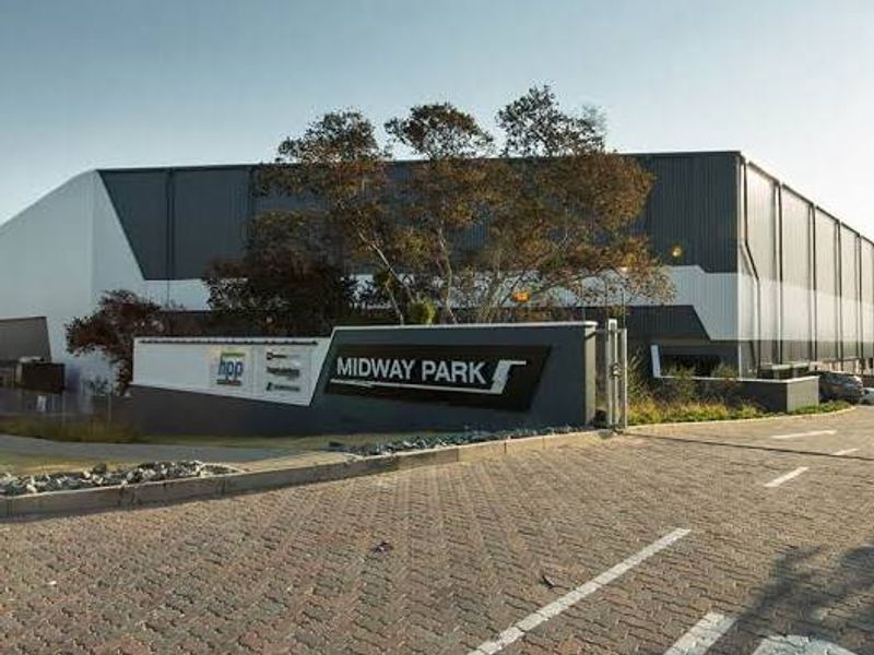 Front view of Midway Park industrial facility featuring modern cladding, paved driveway, and prominent signage.