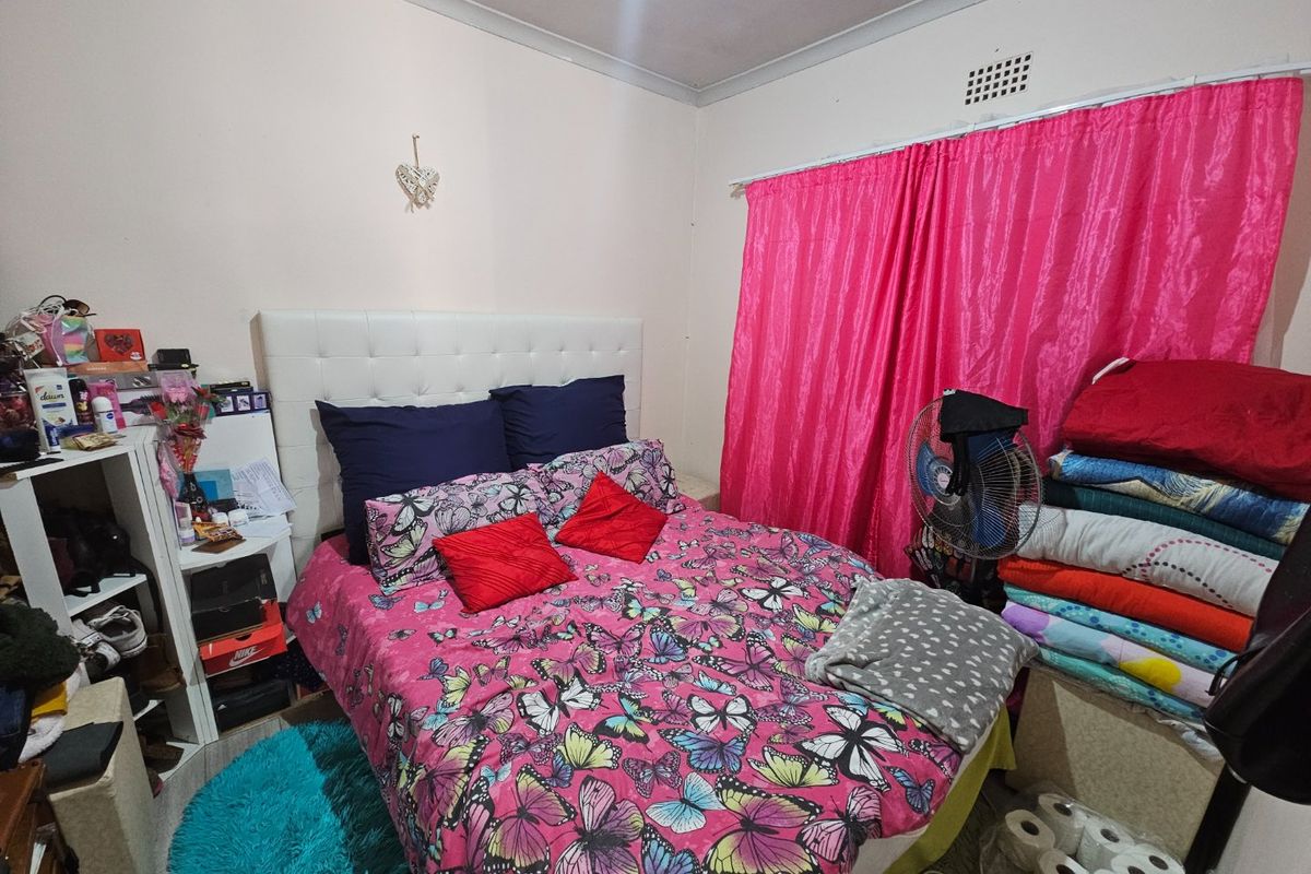 A standard bedroom featuring a ventilation grille and basic finishes, suitable for a refresh to enhance its appeal.