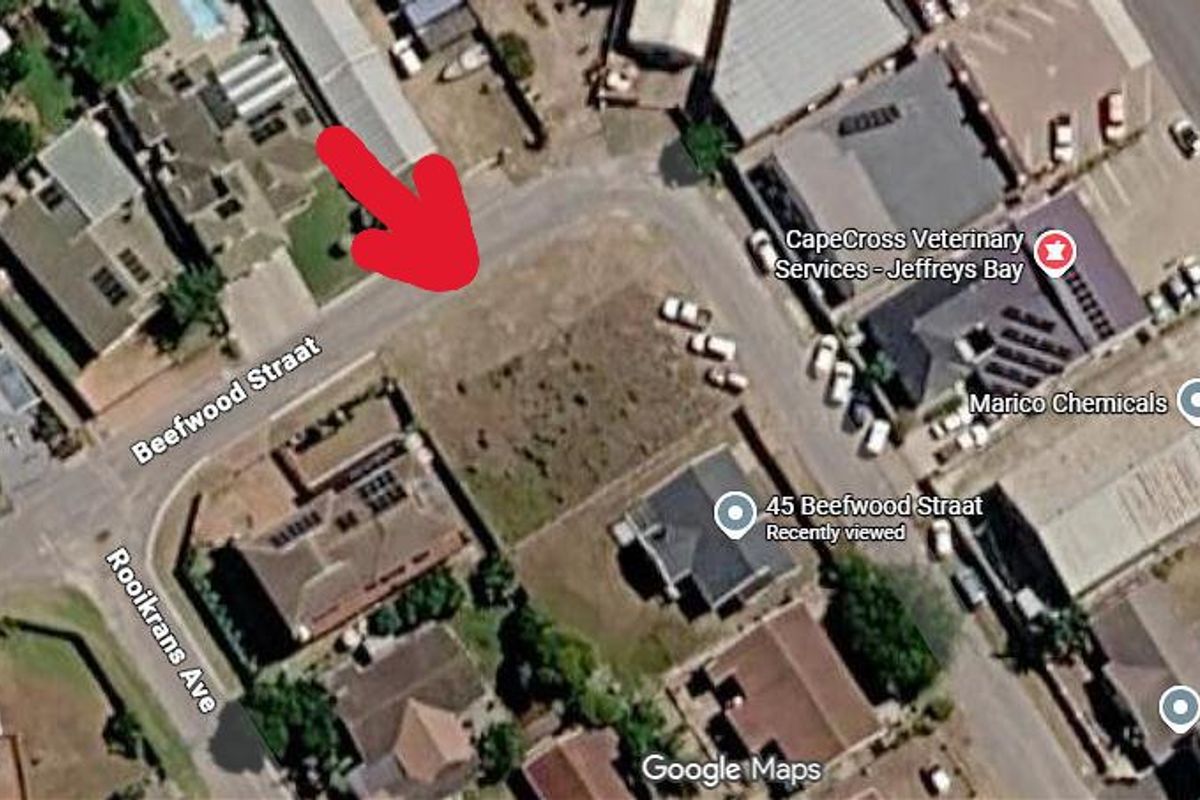 Aerial view of a vacant residential plot located on Beefwood Straat, showing surrounding neighborhood infrastructure and street access.