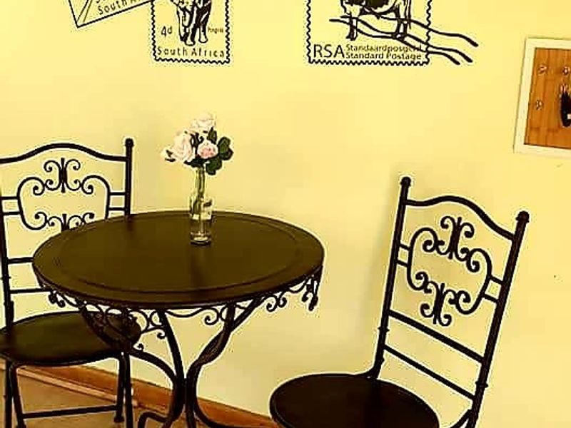 A small corner area featuring tiled flooring and decorative wall decals.