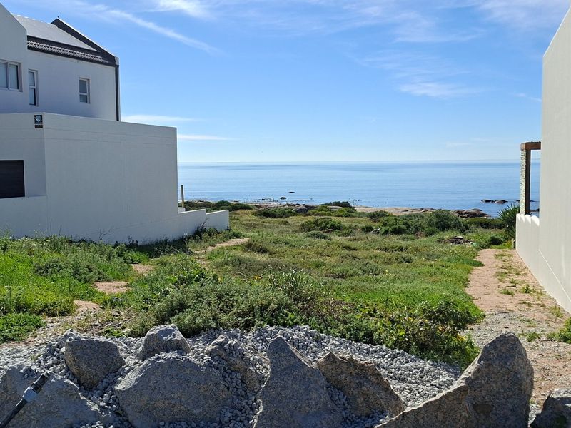 A scenic view of the ocean and coastal landscape from the residential property.