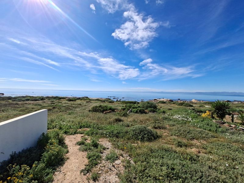 A scenic view of the coastal landscape and ocean from the vacant residential property.