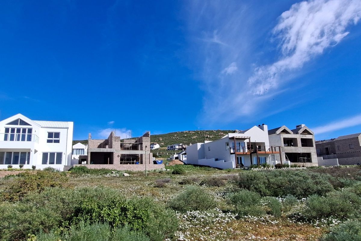 A view of a residential development area featuring a mix of completed homes and properties currently under construction.