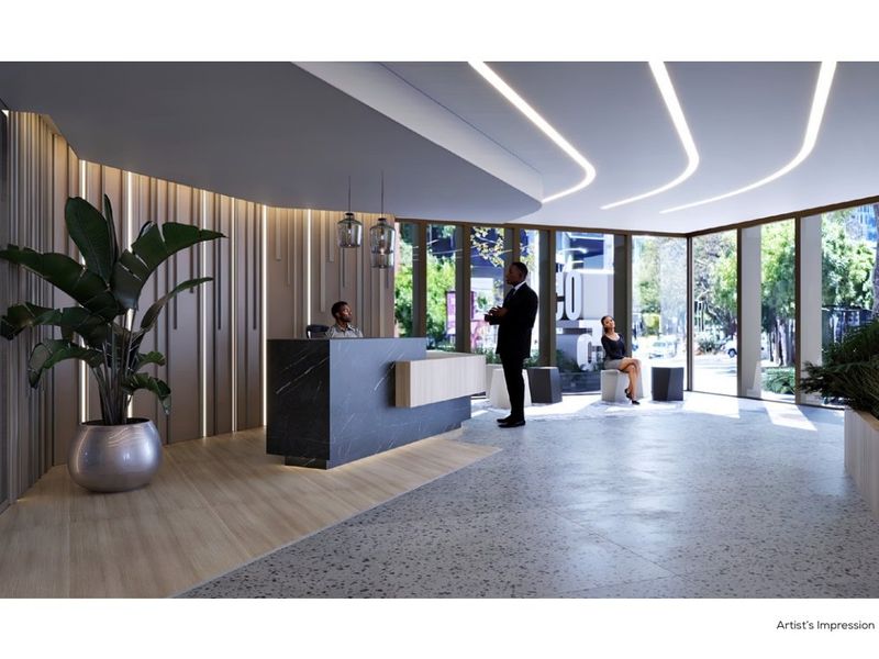 Modern commercial lobby featuring a sleek reception desk, floor-to-ceiling windows, integrated linear ceiling lighting, and high-end timber and terrazzo finishes.