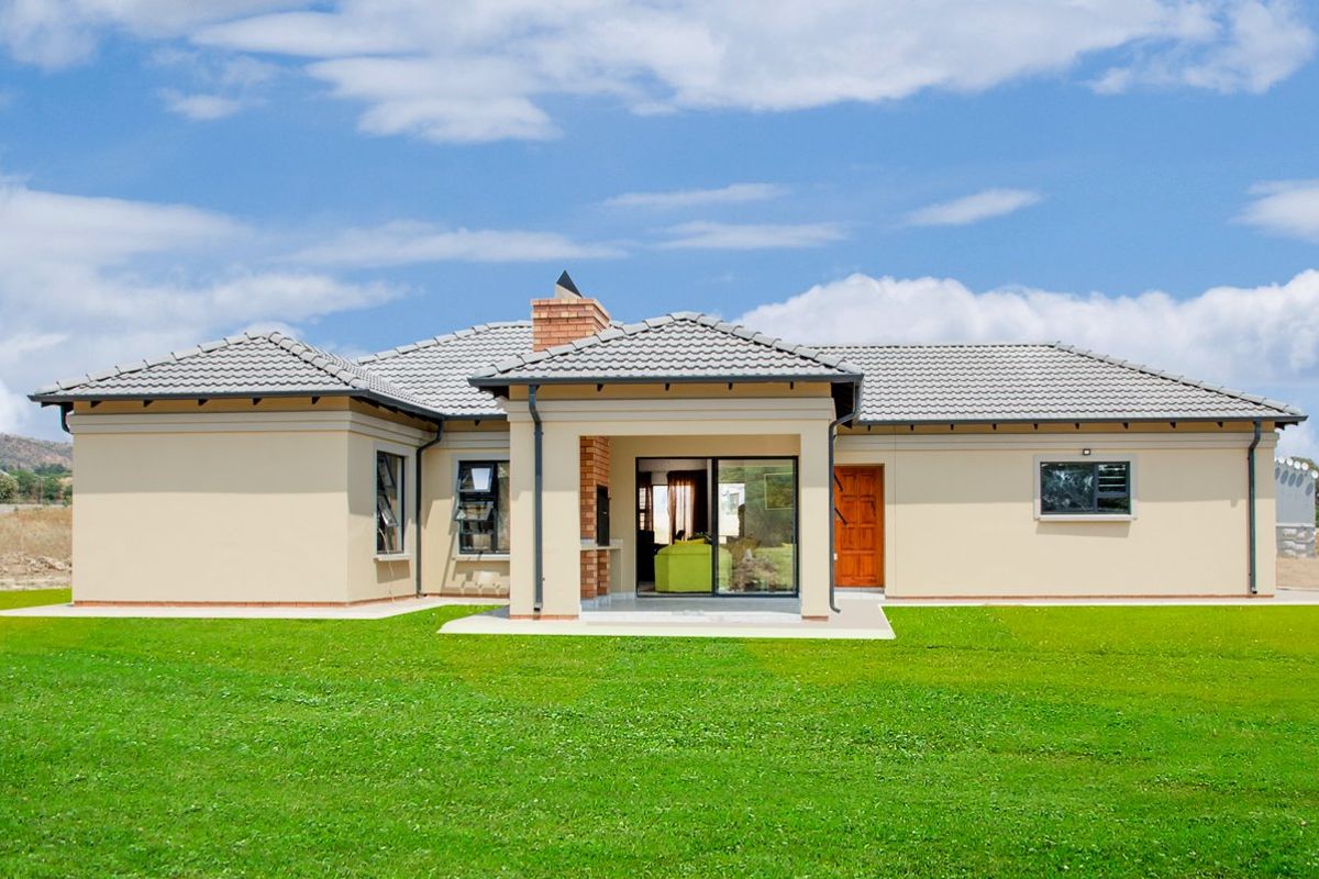Rear view of a modern single-story house featuring a covered patio with a built-in braai, tiled roof, and expansive lawn.