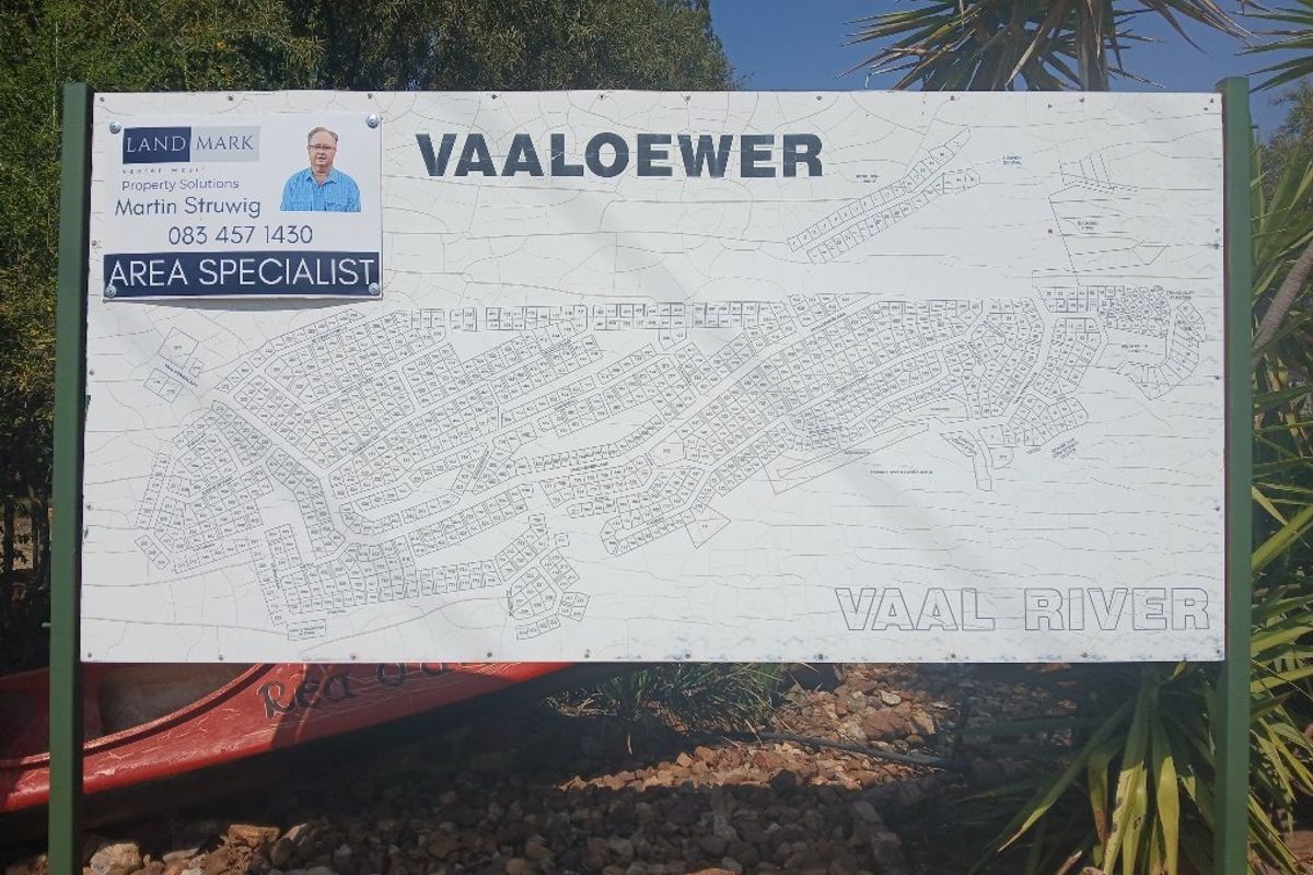 A site map signage board displaying the layout of the Vaaloewer residential area near the Vaal River.