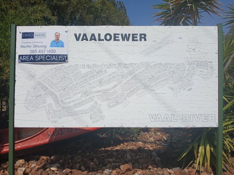 A site map signage board displaying the layout of the Vaaloewer residential area near the Vaal River.