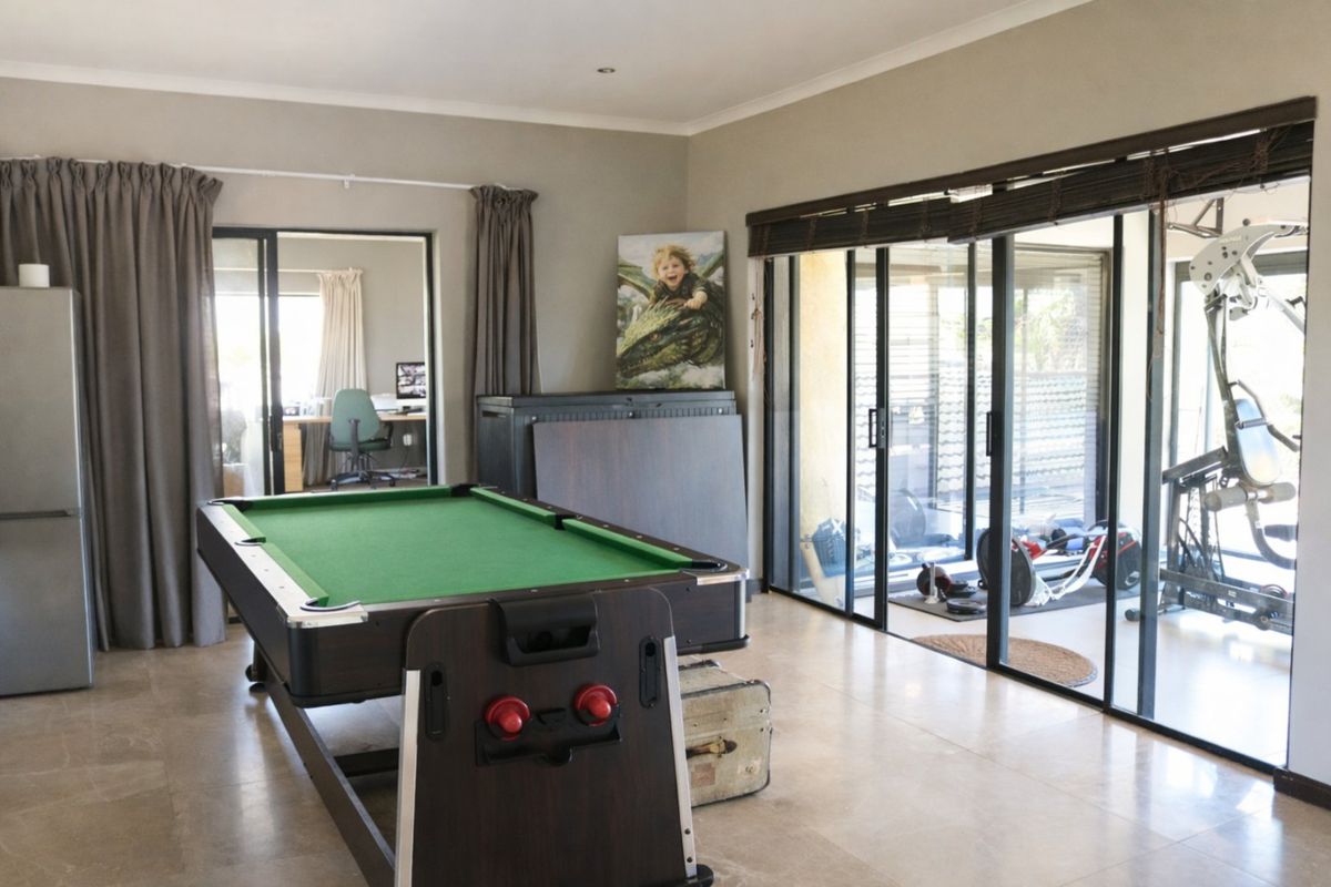 Spacious living area featuring large sliding glass doors that provide natural light and access to the outdoor space.
