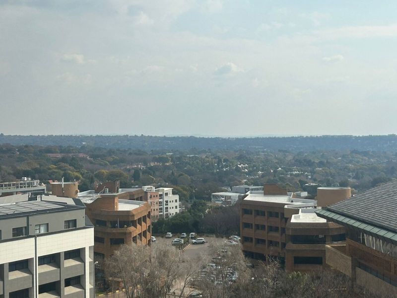 An elevated view overlooking the surrounding urban landscape and neighborhood buildings.