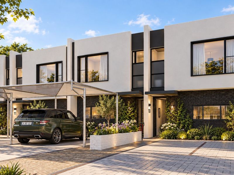 Modern double-story townhouse facade featuring a clean white and dark brick exterior, paved driveway, and a functional carport structure.