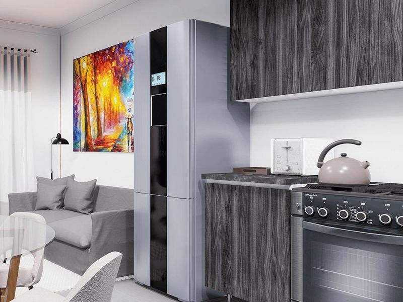Modern open-plan living area featuring a contemporary kitchen with dark wood-grain cabinetry, integrated appliances, and sleek tiled flooring.