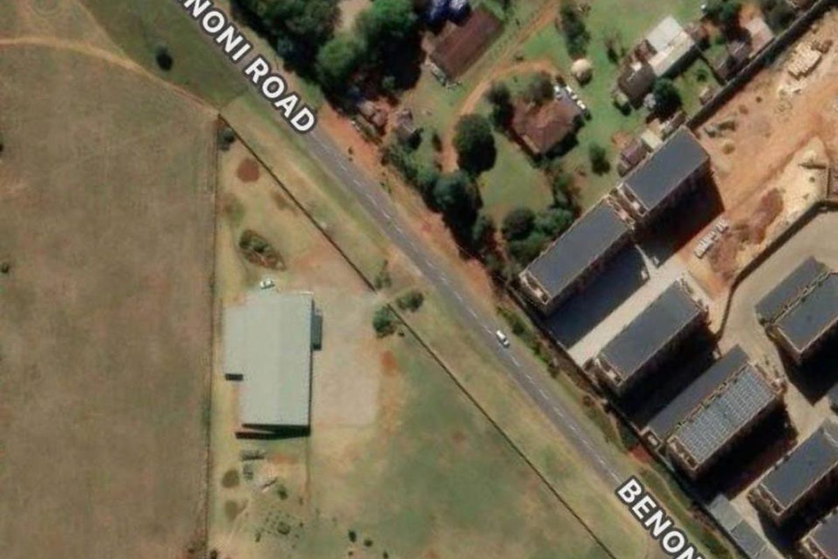 Aerial view of the property location along Benoni Road, showing surrounding land, road access, and nearby structures.