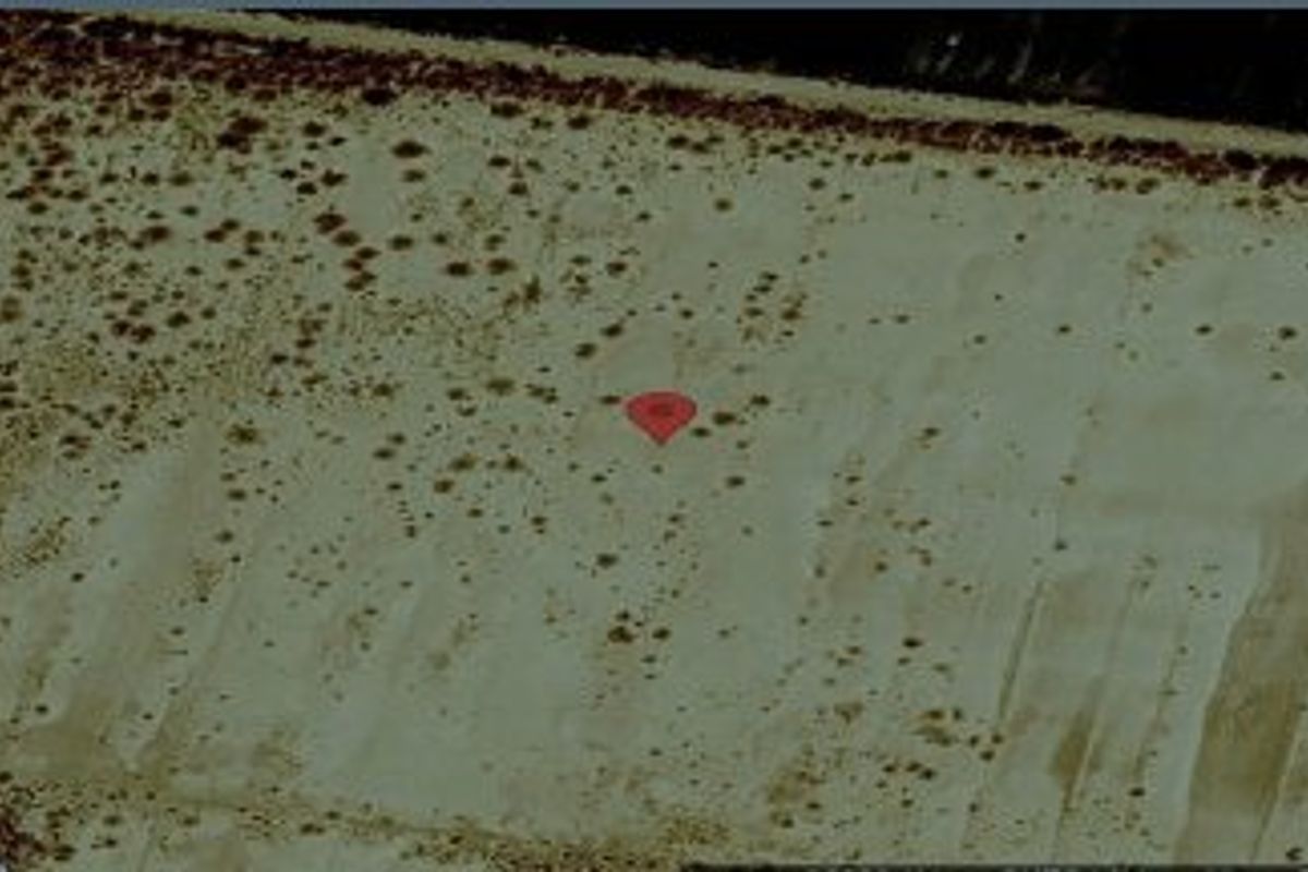 An aerial satellite view of the vacant residential land plot, showing the terrain and boundaries of the property.