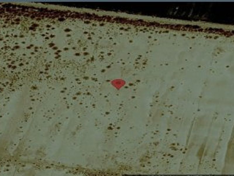 An aerial satellite view of the vacant residential land plot, showing the terrain and boundaries of the property.