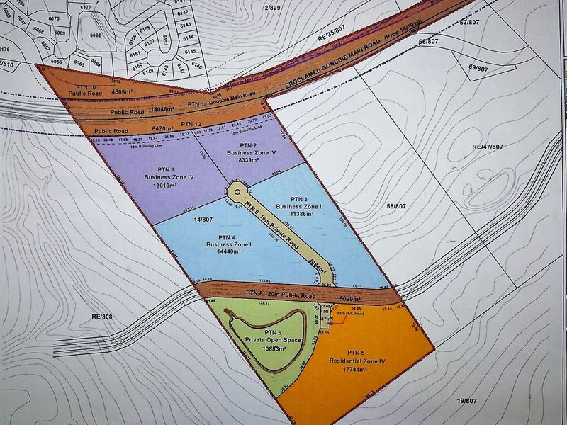 A detailed cadastral layout plan showing the subdivision of land parcels, including business zones, residential zones, and public road access.