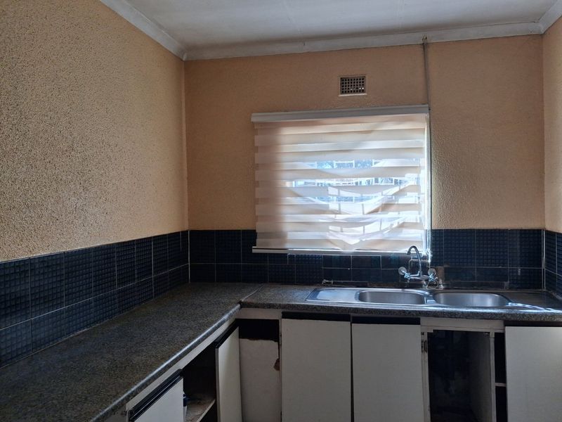 A Little TLC Can Turn This Property Into Family Home - Photo 6
