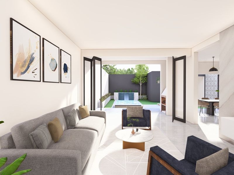 Modern open-plan living area featuring large bi-fold doors opening to a patio with a water feature, stone accent wall, and sleek tiled flooring.