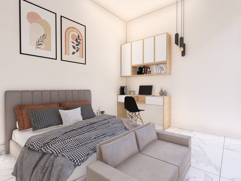 Modern bedroom featuring marble-look flooring, built-in desk with overhead storage cabinetry, and contemporary pendant lighting.