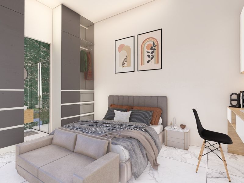 Modern bedroom featuring built-in wardrobes, a custom desk with floating shelving, and marble-look flooring, with direct access to an en-suite bathroom.