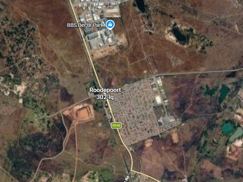 An aerial satellite view showing the surrounding landscape and road infrastructure near the Roodepoort 302-Iq area.