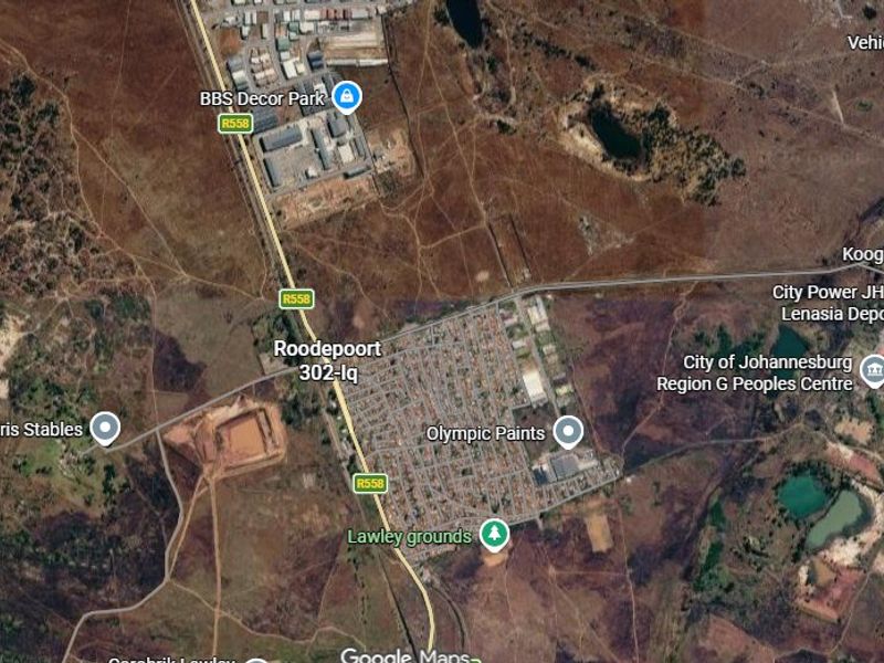 An aerial satellite view showing the surrounding area and infrastructure near the property location.