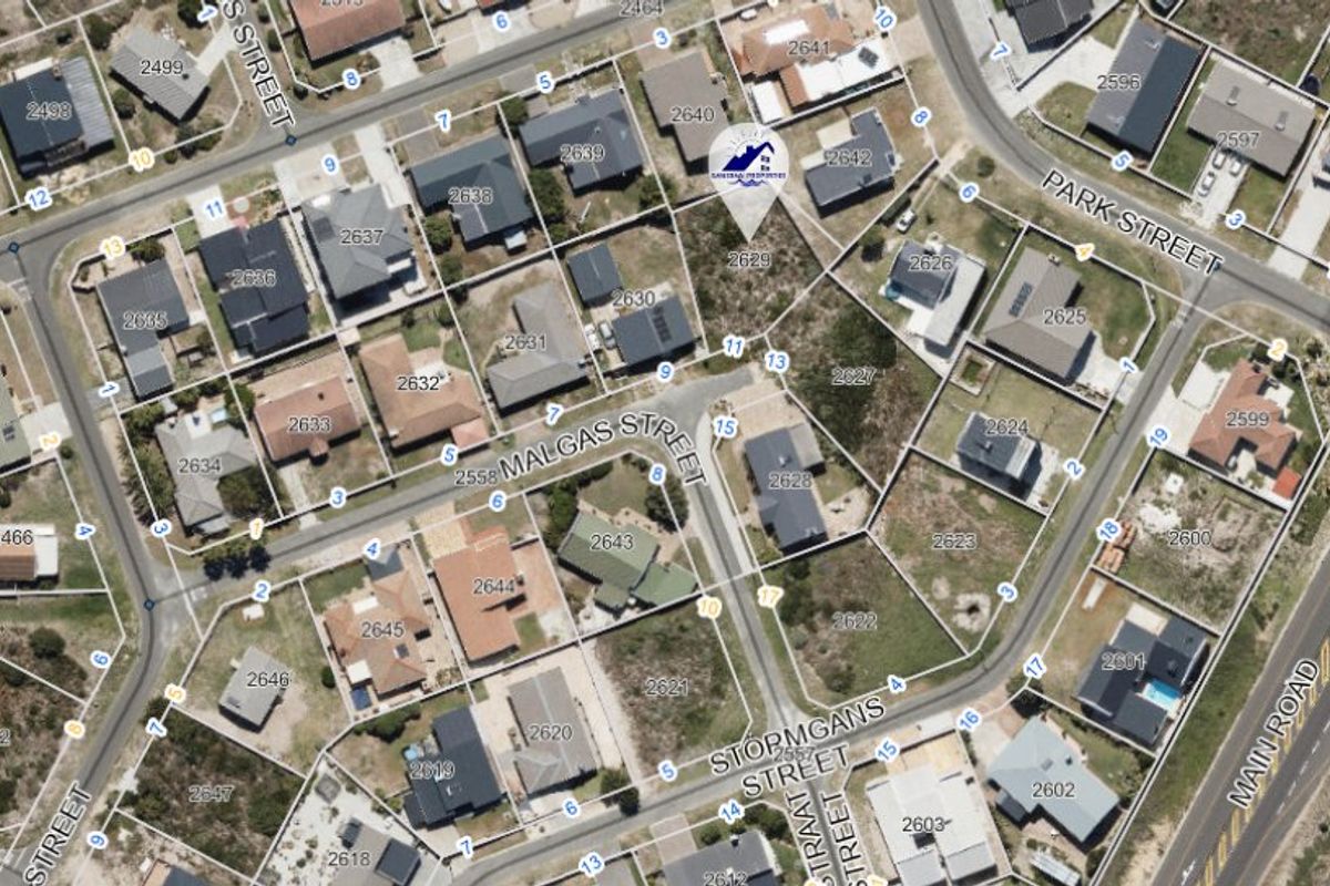 An aerial view of a residential neighborhood showing the layout of plots and street infrastructure.