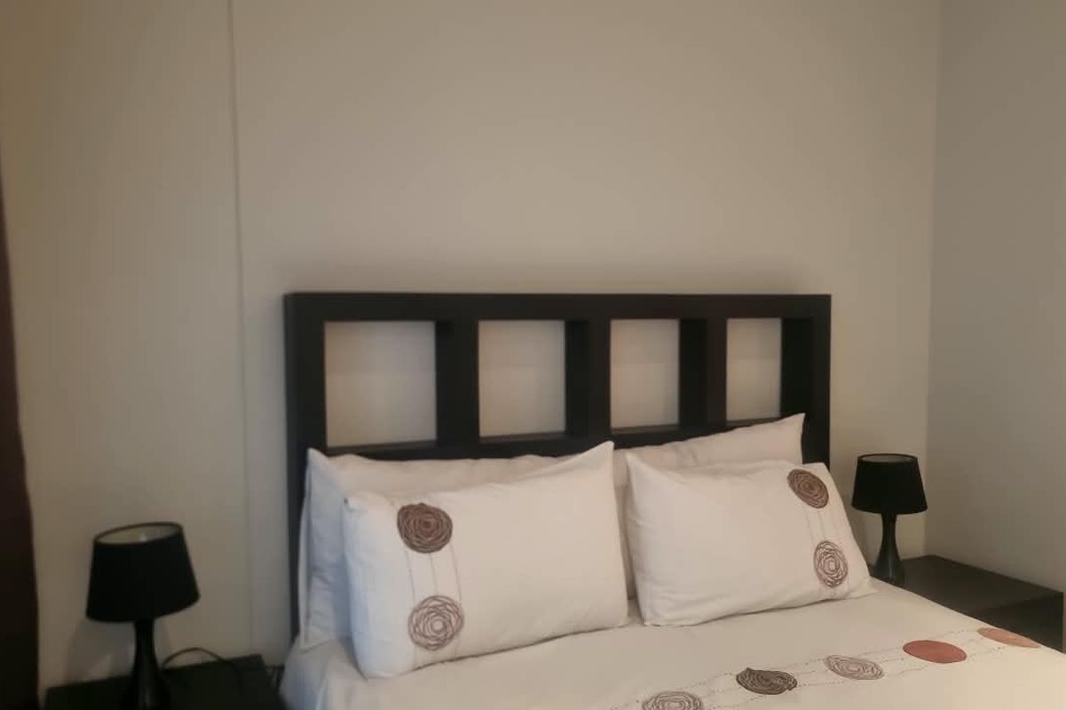A standard bedroom featuring neutral wall finishes and a simple layout, suitable for personalization.