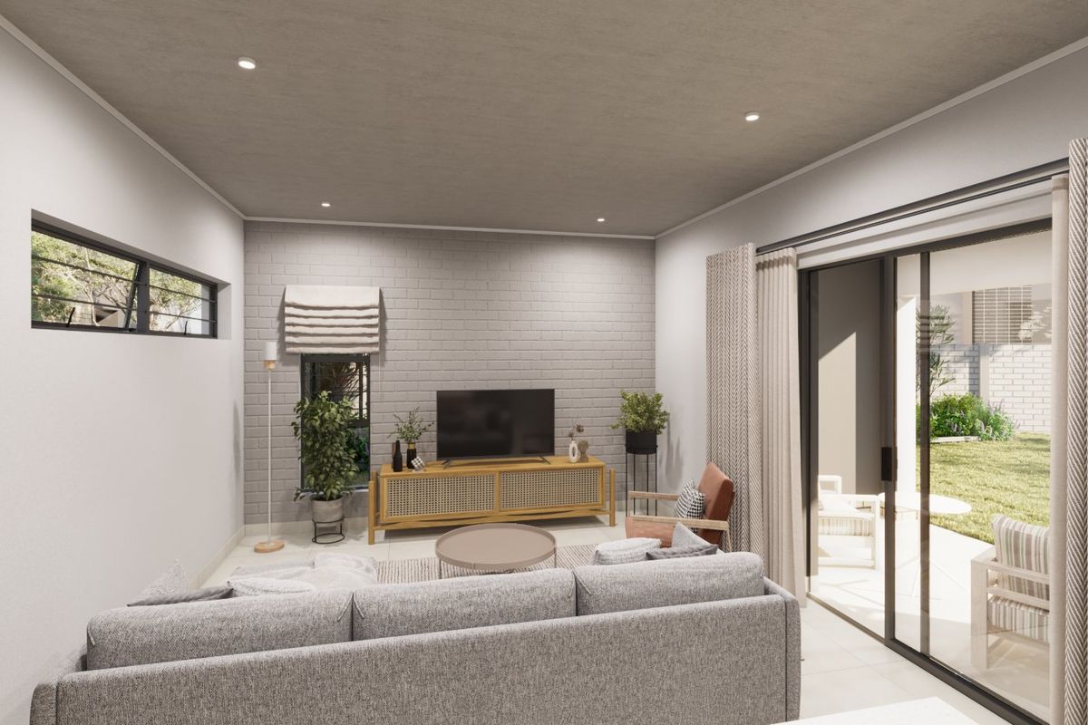 Modern living room featuring an exposed brick accent wall, recessed downlighting, and large sliding glass doors providing seamless access to the outdoor patio area.