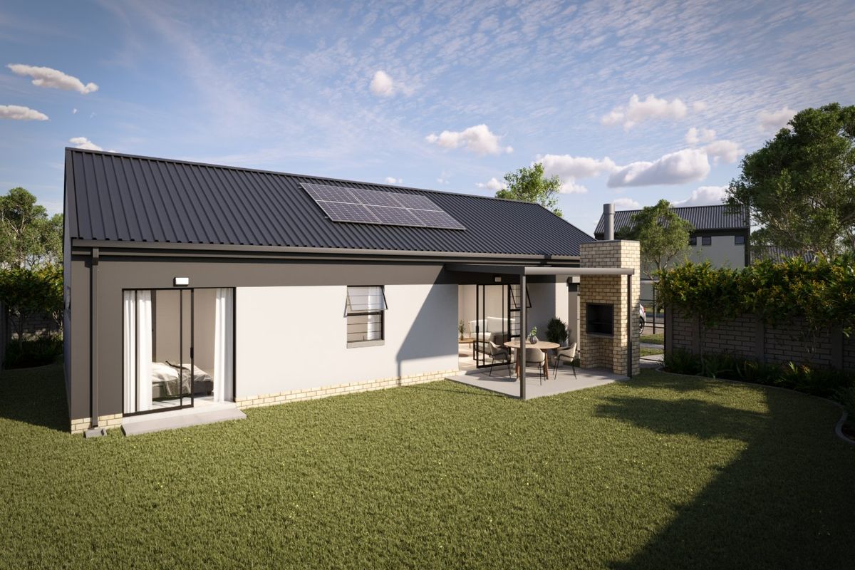 Rear view of a modern home featuring a metal roof with solar panels, a covered patio with a built-in brick fireplace, and a private garden.