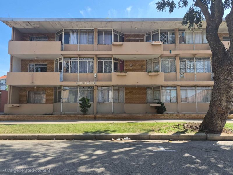 Front elevation of the Hurstwood apartment complex featuring a multi-story brick facade with balconies and security-fitted windows.