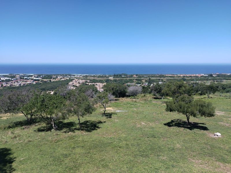 An elevated, expansive view overlooking the coastal landscape and the ocean horizon.