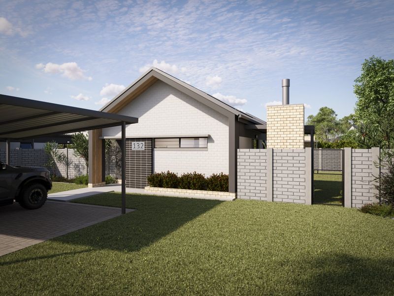 Modern single-story house exterior featuring a brick facade, attached carport, and a prominent chimney, set within a landscaped residential plot.