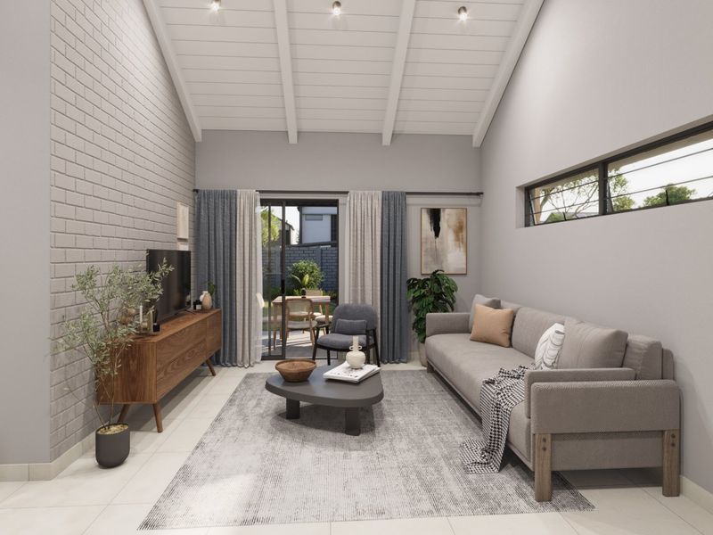 Modern living room featuring a high vaulted ceiling with exposed beams, a textured brick feature wall, and sliding doors leading to an outdoor patio area.
