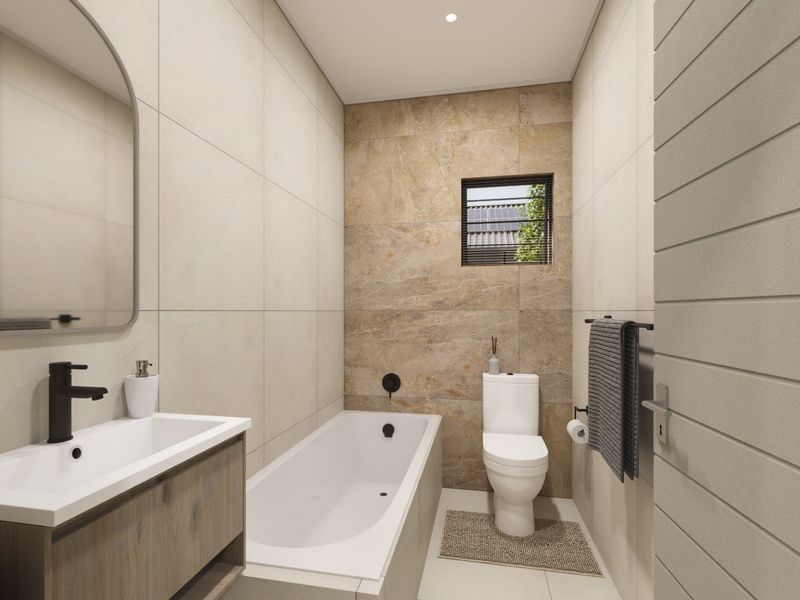 Modern bathroom featuring a built-in vanity, bathtub, toilet, and contemporary tiled finishes with neutral tones.