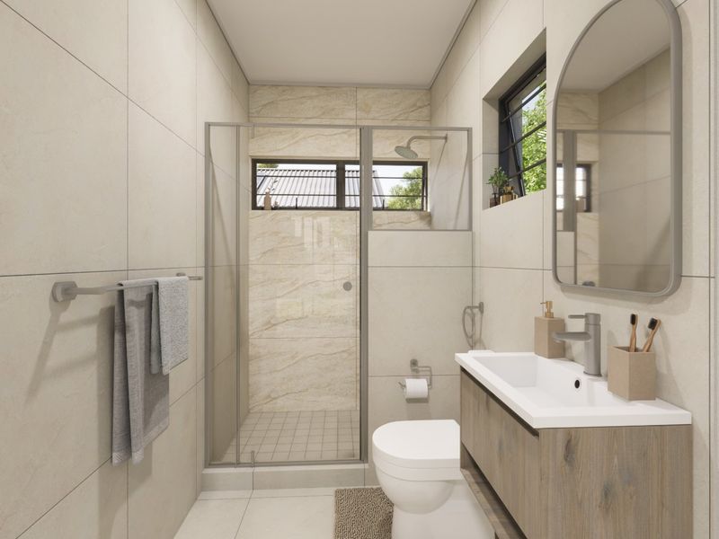 Modern bathroom featuring a walk-in shower, vanity cabinet with basin, toilet, and neutral floor-to-ceiling tiling.