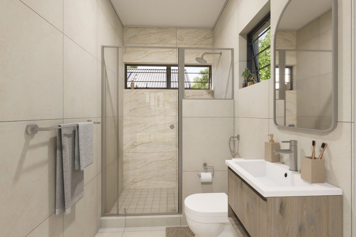 Modern bathroom featuring a walk-in shower, vanity cabinet with basin, toilet, and neutral floor-to-ceiling tiling.