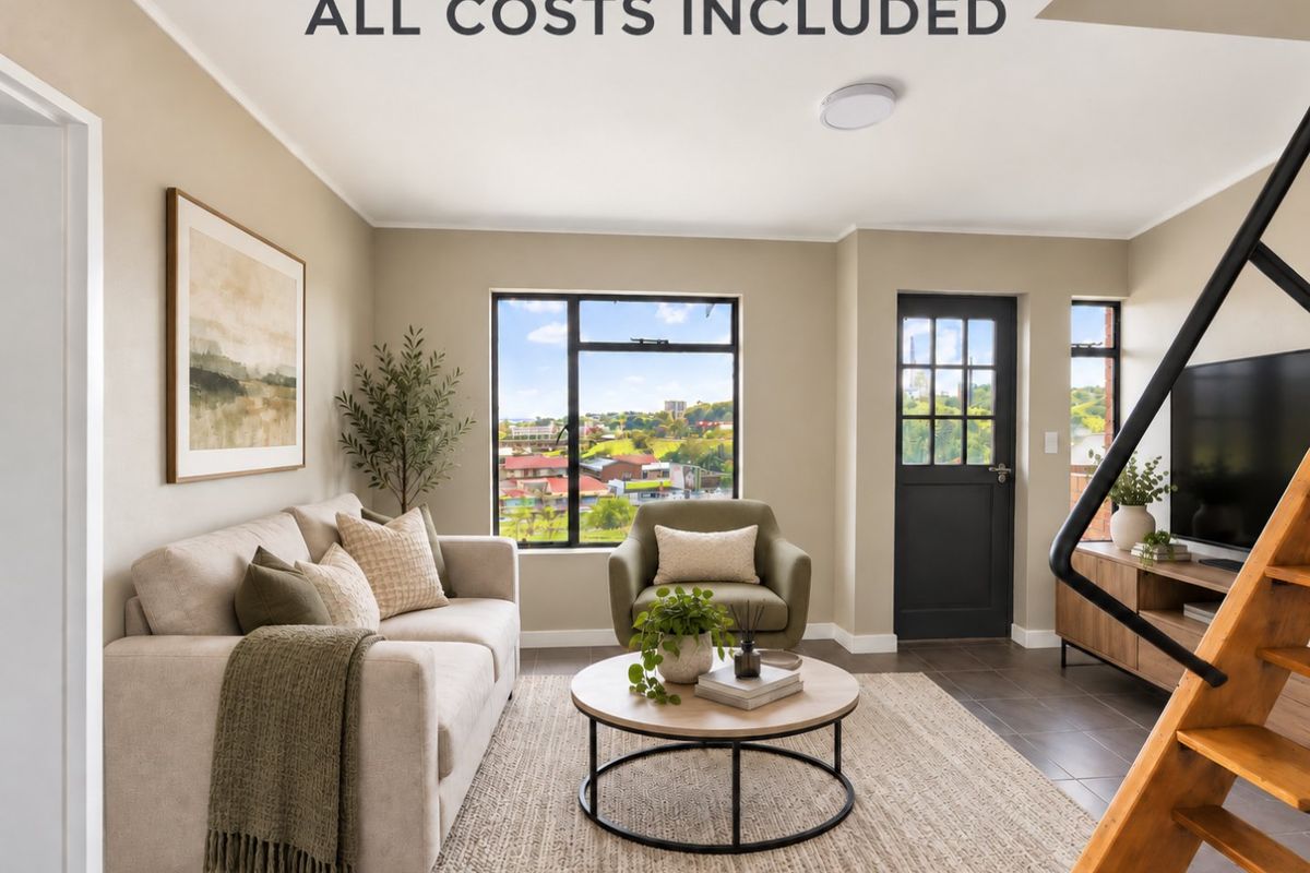 A bright and modern living room featuring tiled floors, large windows with scenic views, and direct access to an exterior door.