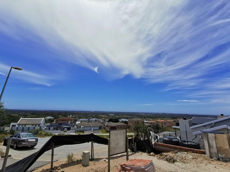 Elevated view overlooking the surrounding residential neighbourhood and landscape from the vacant land plot.