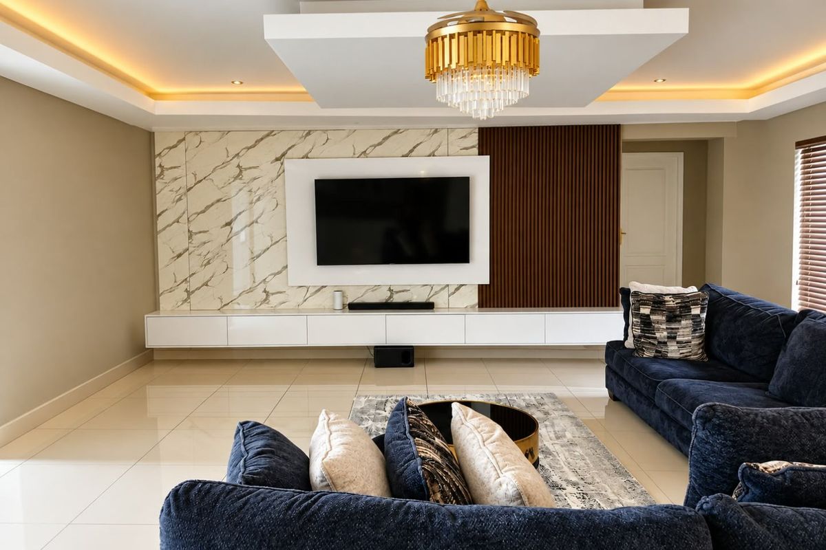 Modern living room featuring a sophisticated feature wall with marble and timber accents, floating cabinetry, and elegant recessed ceiling lighting.