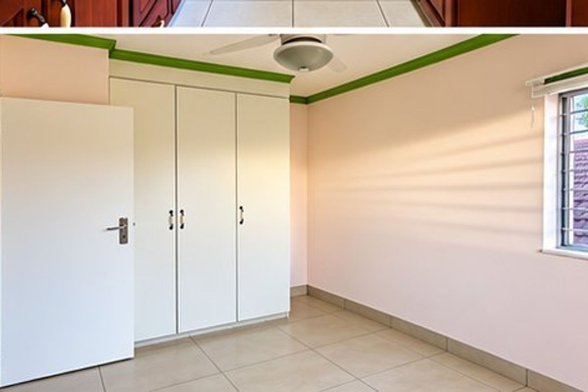 A bedroom featuring built-in cupboards, tiled flooring, and a ceiling fan, with security bars installed on the window.