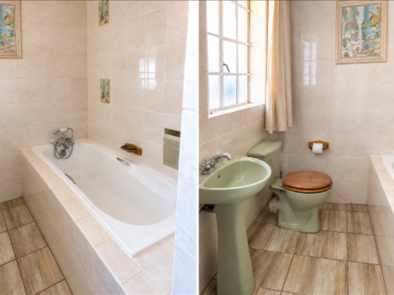A bathroom featuring a built-in bathtub, pedestal basin, and toilet with tiled finishes throughout.