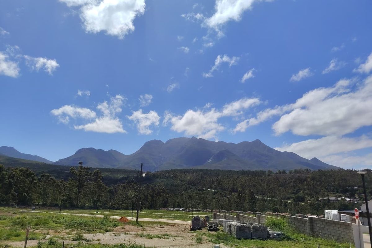 Scenic landscape view featuring expansive mountain ranges and natural surroundings, providing a peaceful outlook from the property.