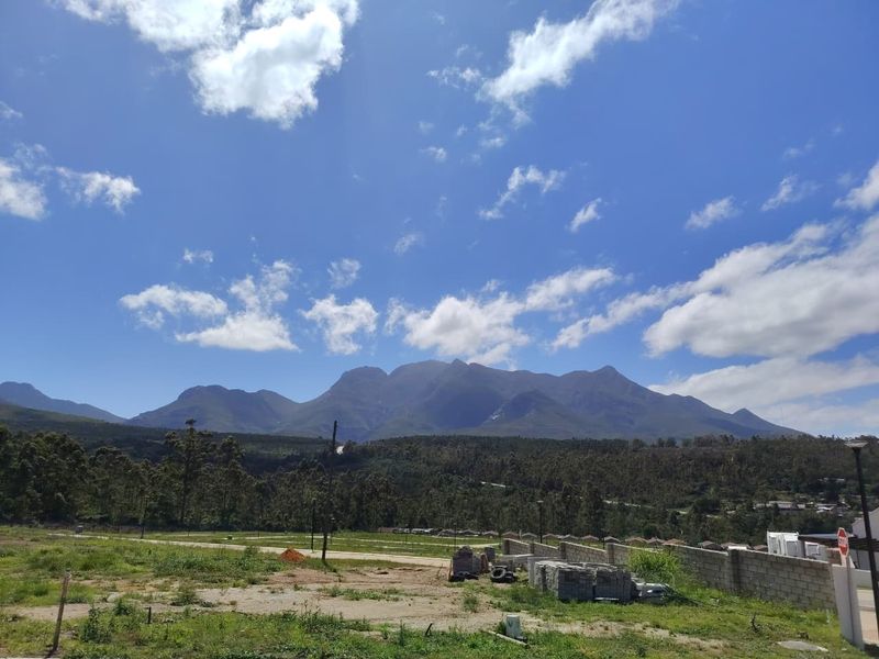 Scenic landscape view featuring expansive mountain ranges and natural surroundings, providing a peaceful outlook from the property.