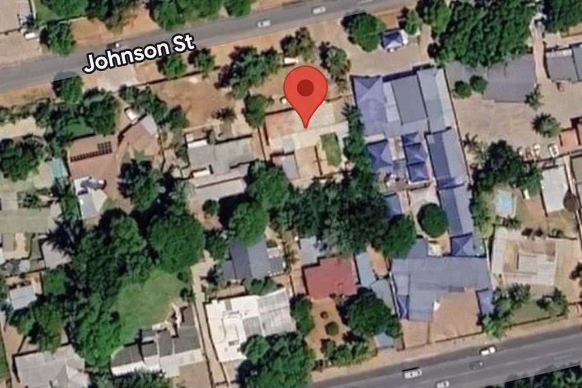 An aerial satellite view showing the property location and surrounding neighborhood layout between Johnson Street and Grobler Street.