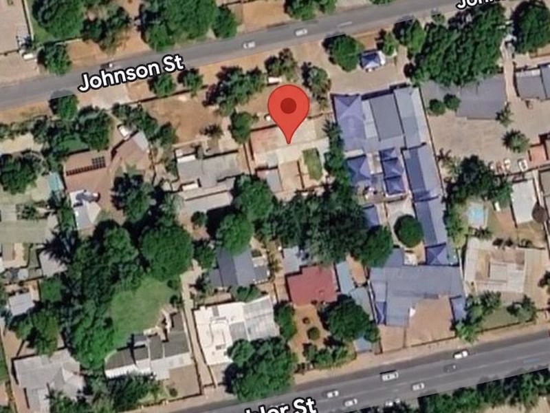 An aerial satellite view showing the property location and surrounding neighborhood layout between Johnson Street and Grobler Street.
