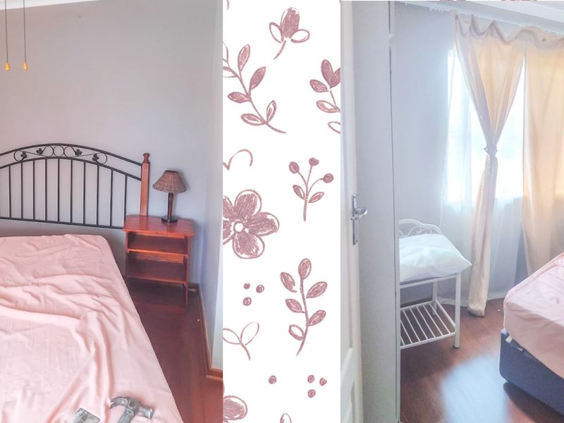 A bedroom featuring laminate flooring and cove cornice detailing.