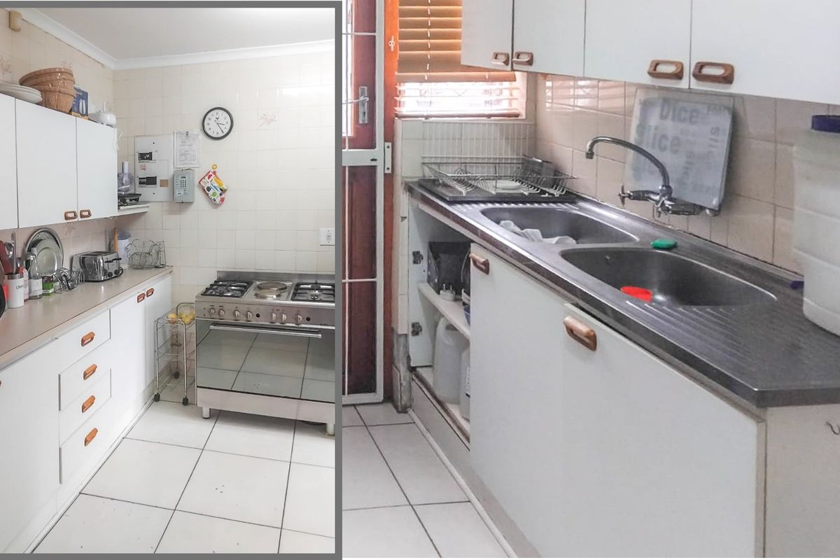 A functional kitchen featuring white cabinetry, a gas stove, and a double bowl sink with tiled splashbacks and flooring.
