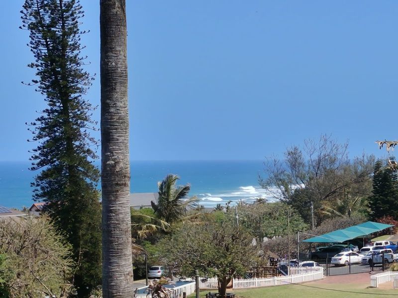 A scenic elevated view overlooking the ocean and surrounding coastal landscape.