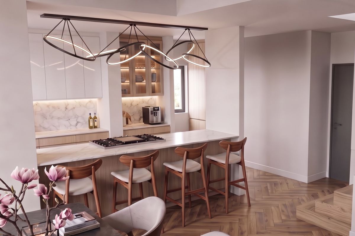 Modern kitchen featuring a marble-look island with integrated gas hob, custom cabinetry, and elegant herringbone timber flooring in a bright, open-plan layout.